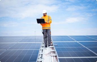 A man verifying the power distribution in the solar panels